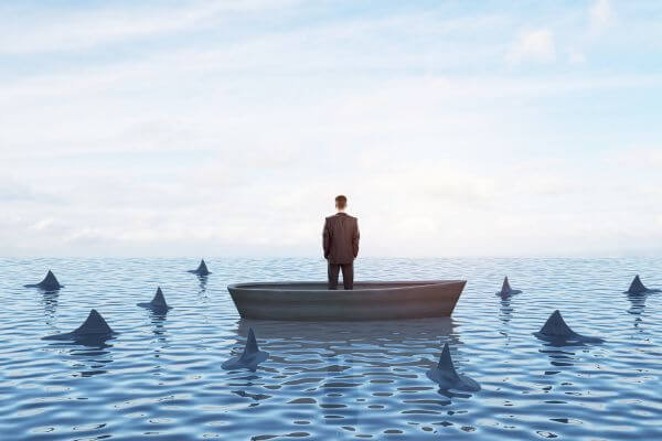 Boat Surrounded by Sharks